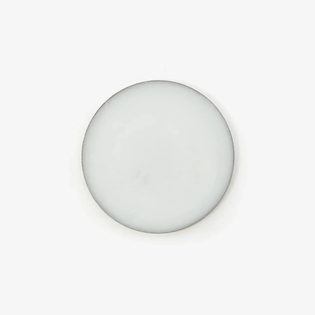 An overhead shot of the solid perfume balm against a white background.