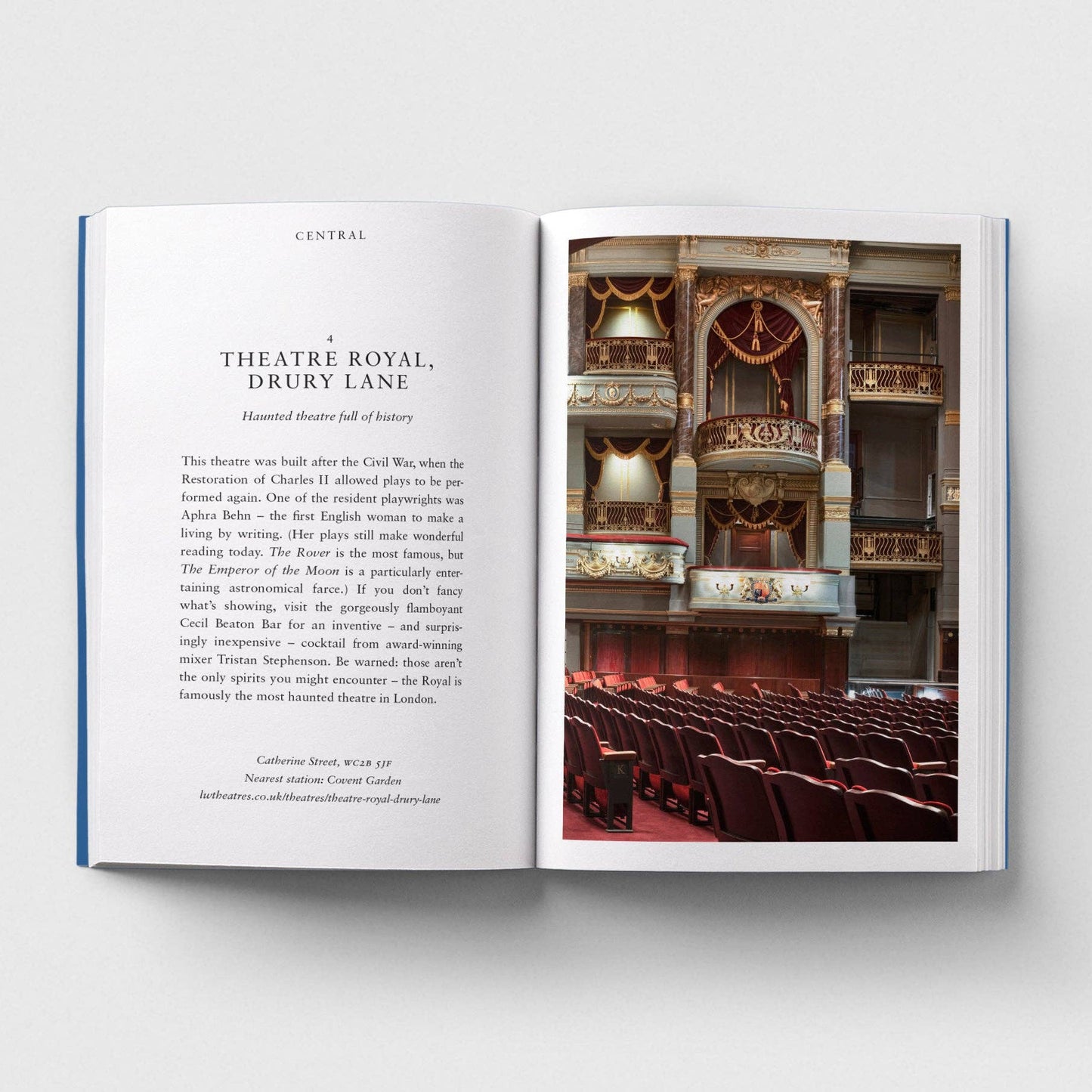 Open book showing a page with text and an image of a theater interior.