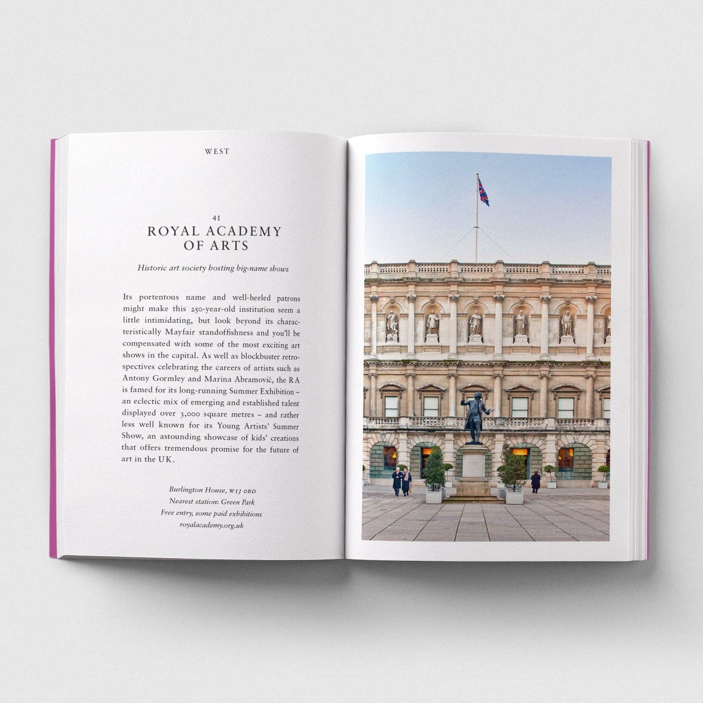 Open book showing a page with text and an image of a building