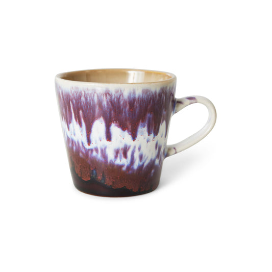 Ceramic mug with a unique glaze pattern on a white background