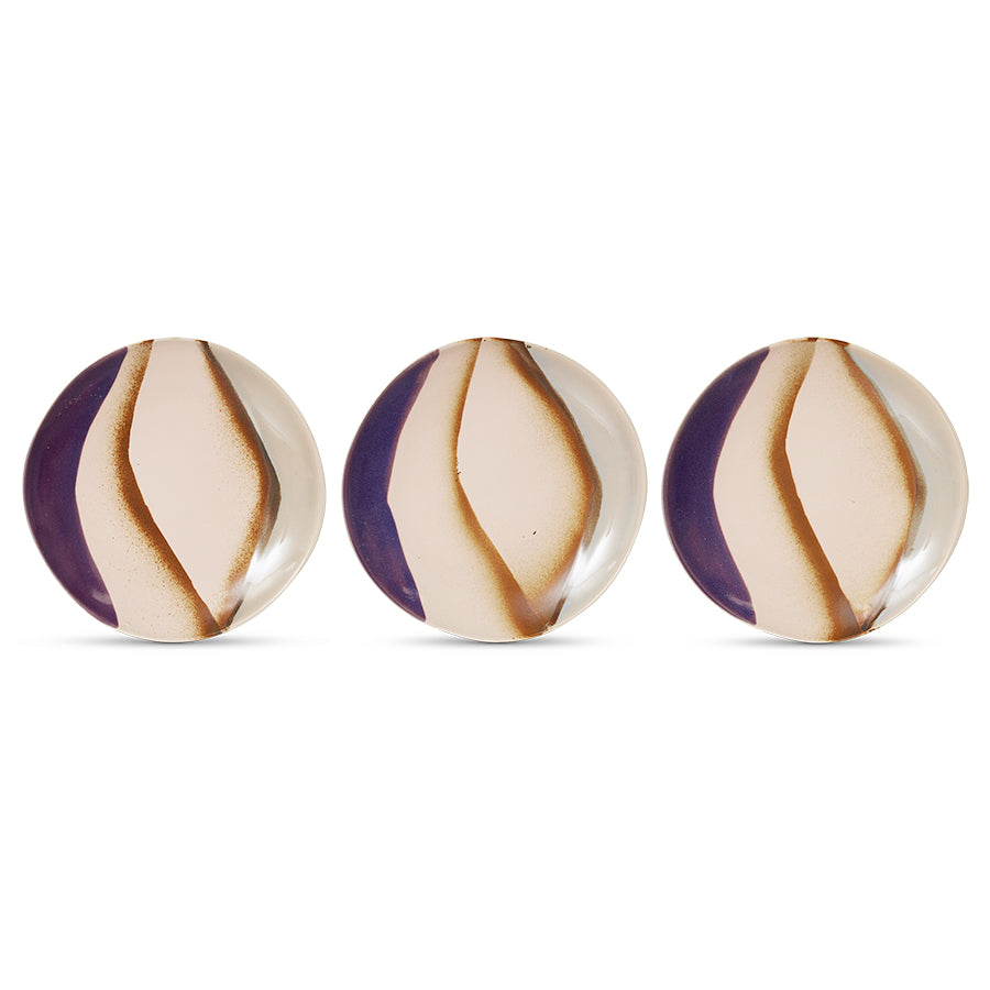 Three round ceramic knobs with purple and beige stripes on a white background