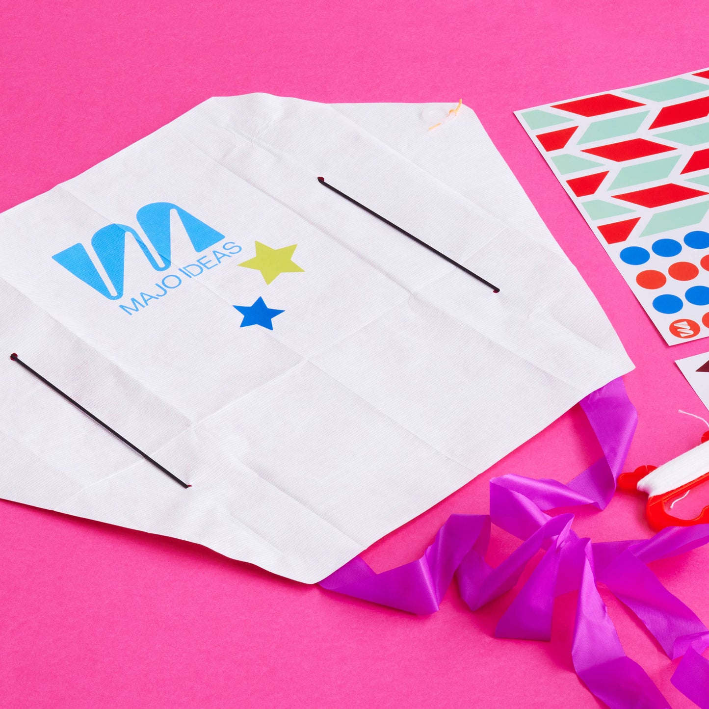 White paper with colourful logos on a pink background