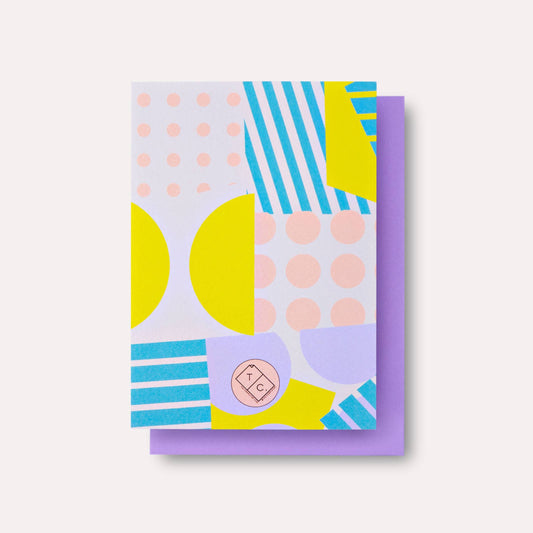 Colorful geometric patterned card with a purple border on a white background