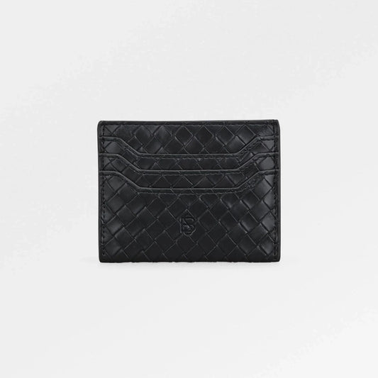 Black quilted cardholder on a light gray background