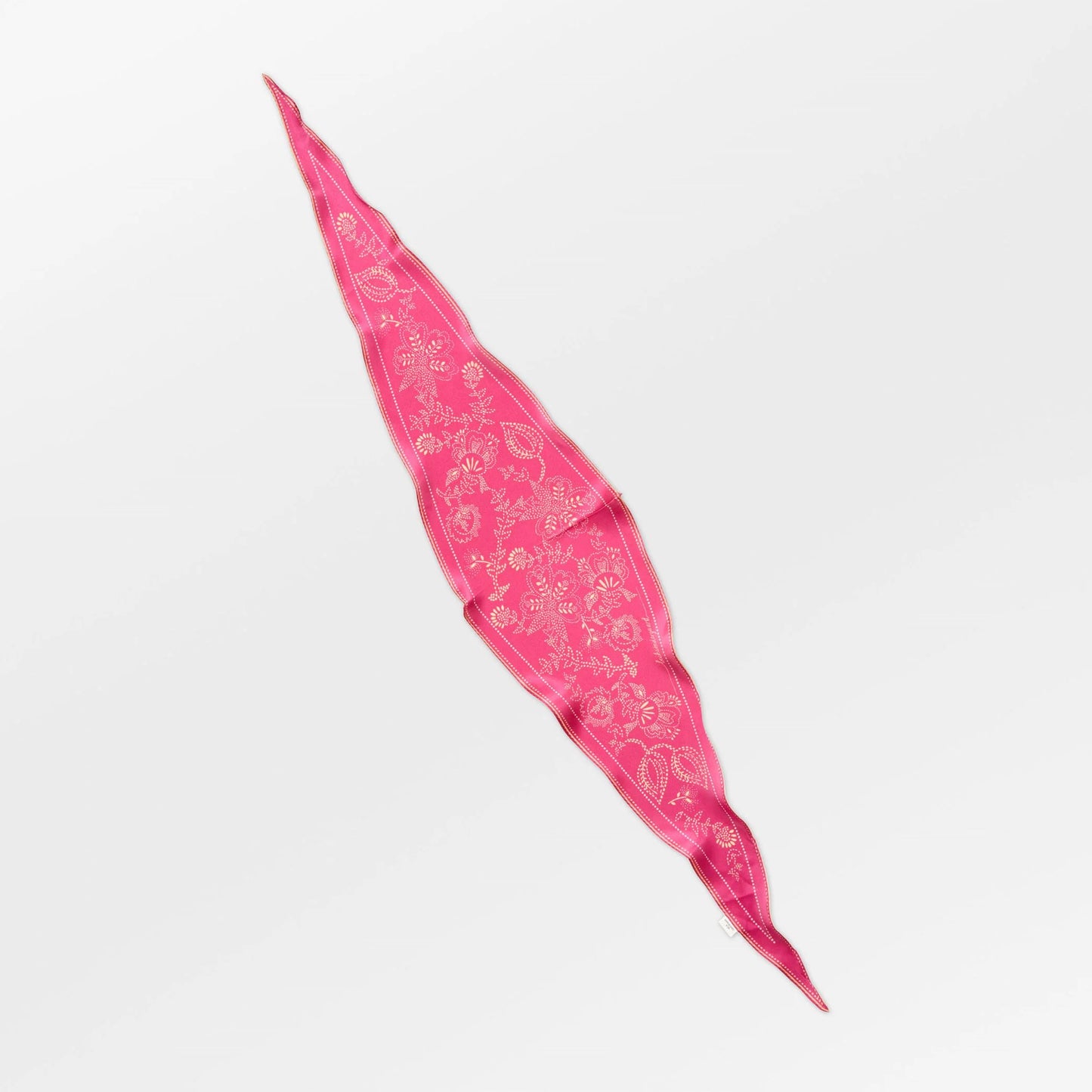 Pink bandana with white patterns on a light gray background