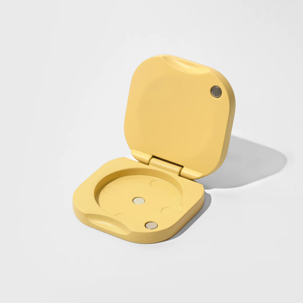 Yellow plastic component on a white background