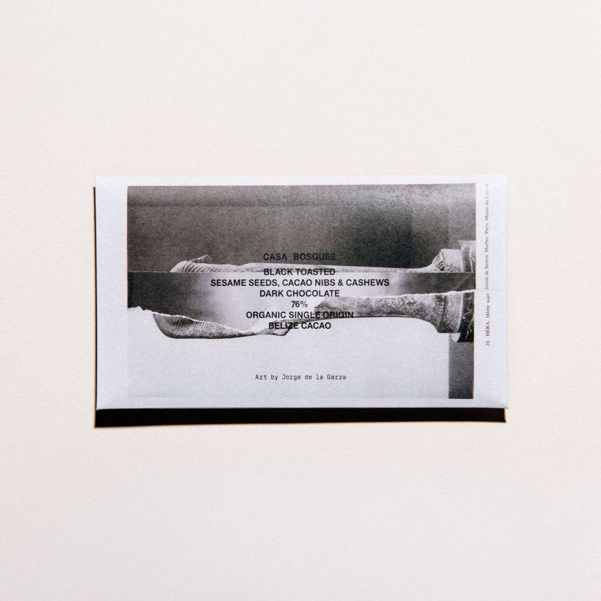 Black and white product packaging with text on a light gray background