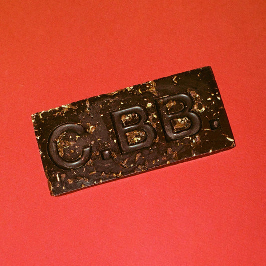 Chocolate bar with 'CBB' branding on a red background