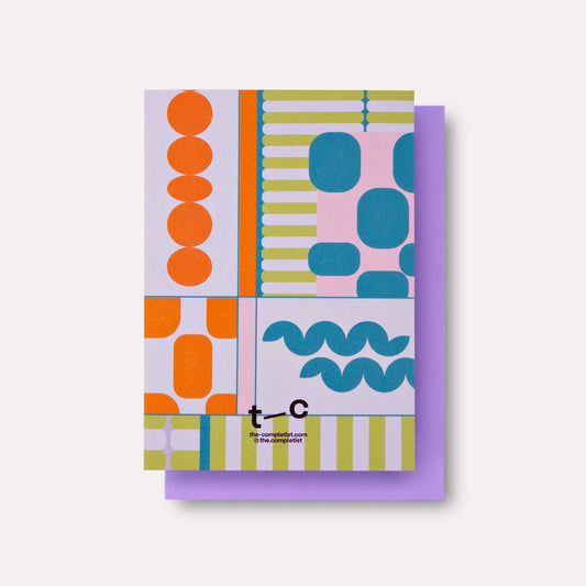 Two colorful patterned notebooks with a visible brand logo on a white background