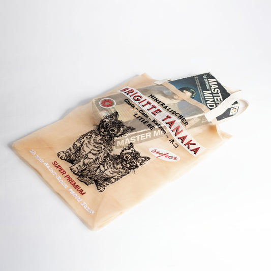 Beige cat-themed product packaging with text on a white background