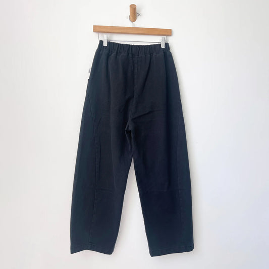 denim black ballon pants with a curved seam on both sides of the leg, with a chunky Rouches elasticated waist band