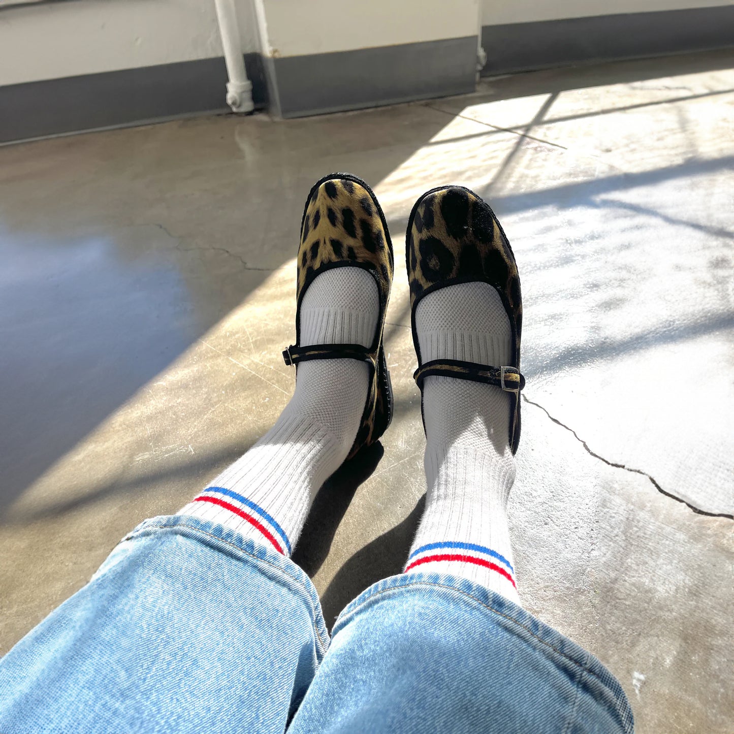 Le Bon Shoppe Boyfriend Socks styled with leopard print Mary Jane shoes and cropped denim, photographed in sunlight.
