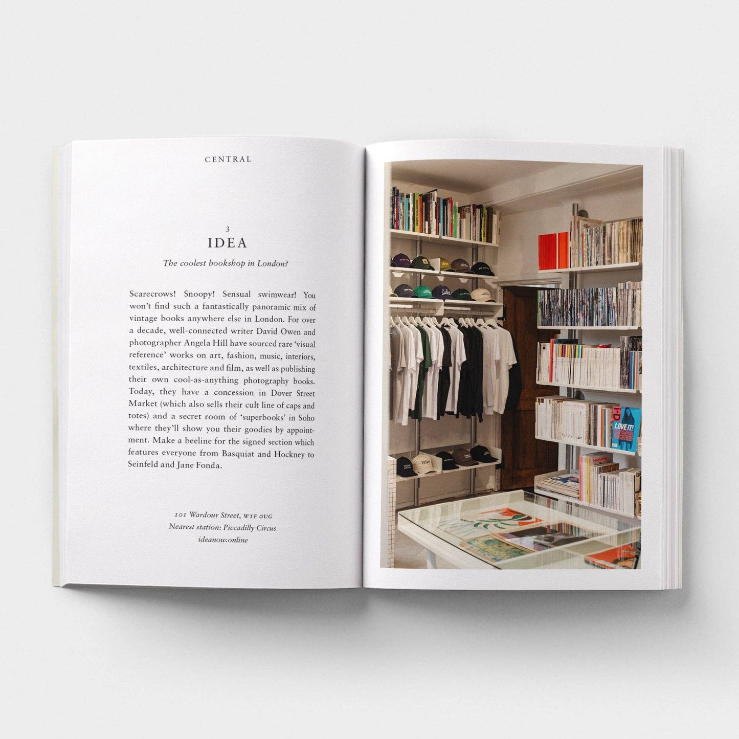 Open book showing text on one page and a photograph of a store interior on the other.