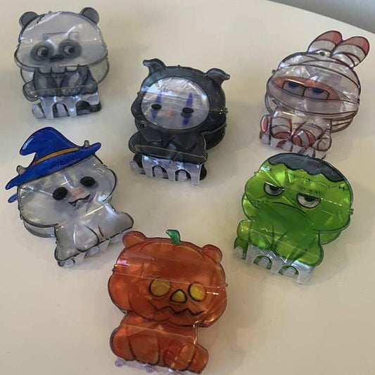 A selection of acrylic hair clips in various shapes for Halloween, for example a pumpkin bear, witch cat, and Mummy rabbit