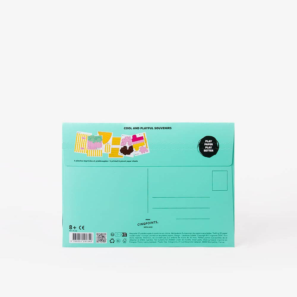 Green packaging with colorful stickers on a white background