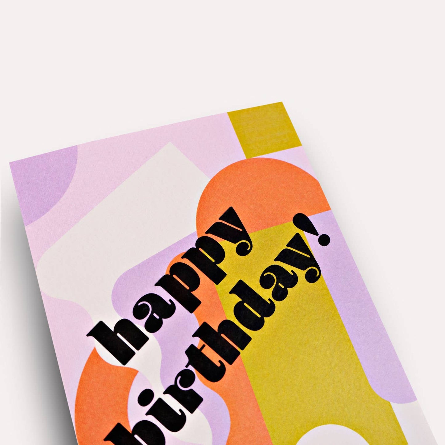 Colorful birthday card with geometric shapes and 'happy birthday!' text on a white background
