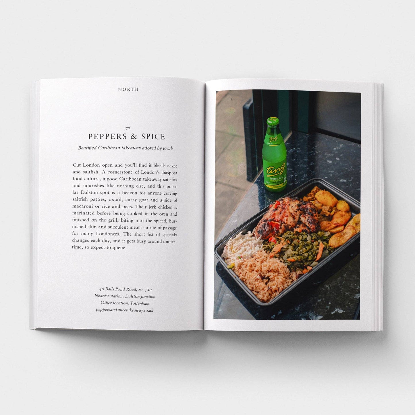 Open book showing a page with text and a photograph of food and a bottle on a table.