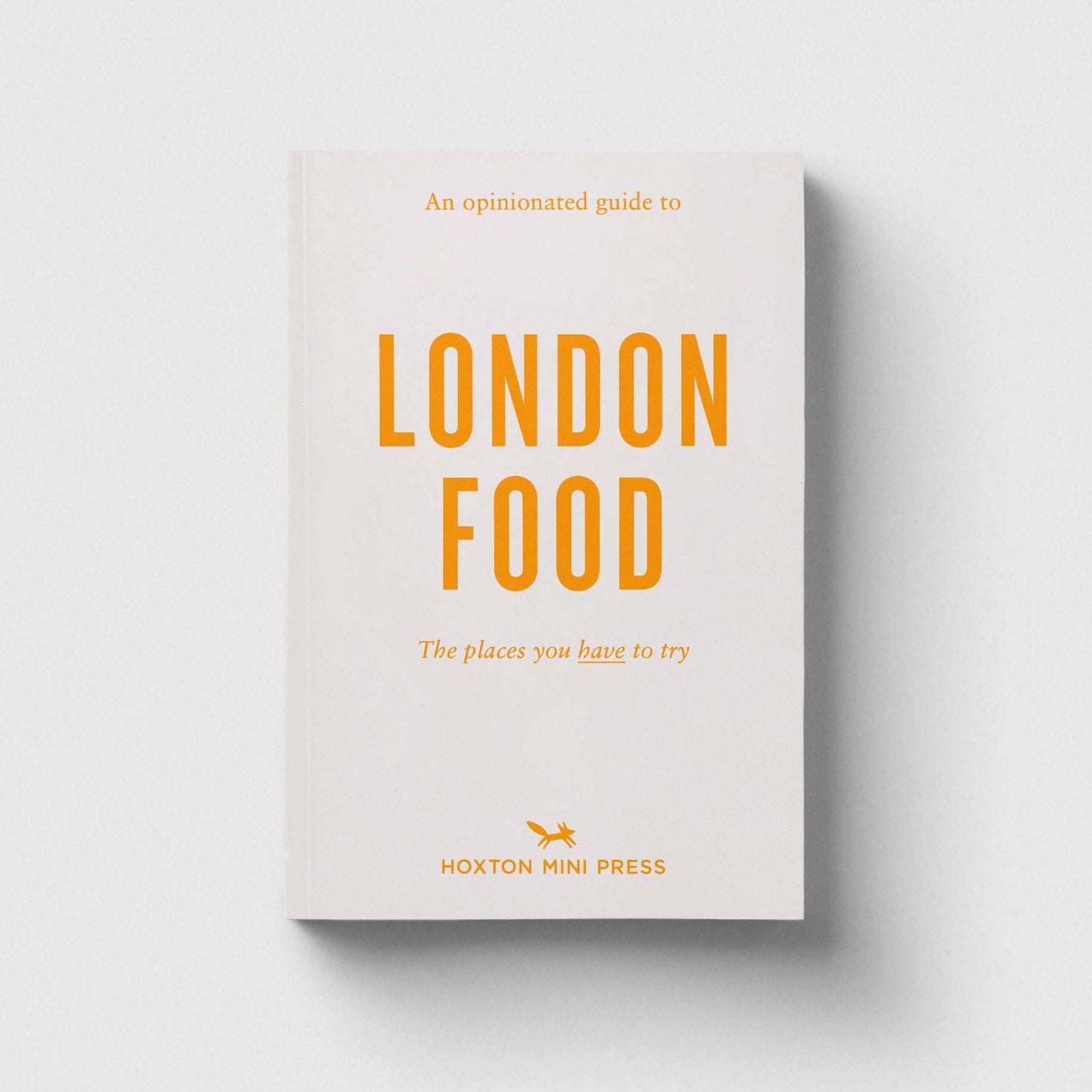 Book titled 'An Opinionated Guide to London Food' by Hoxton Mini Press on a light gray background