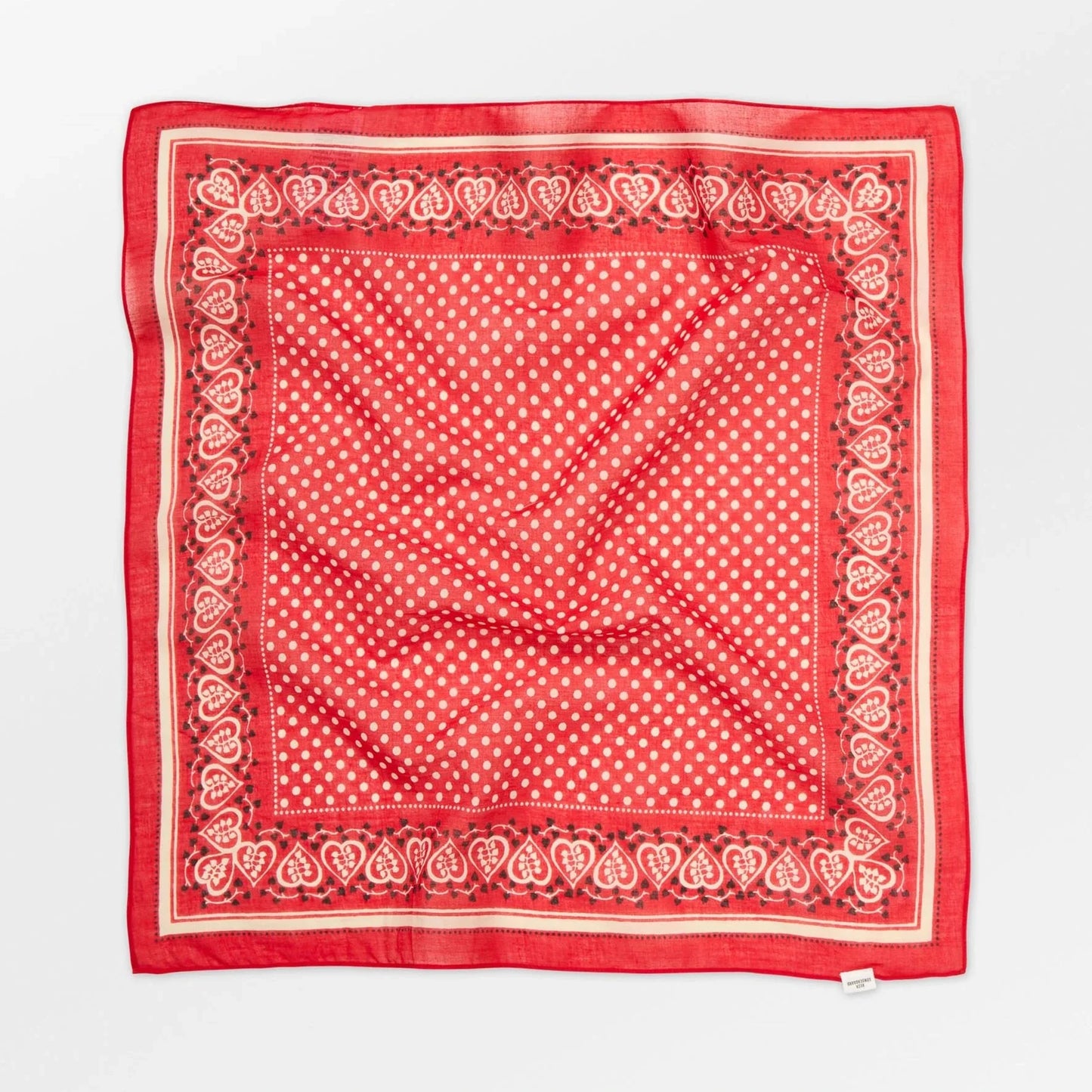 Red bandana with white polka dots and border on a white background