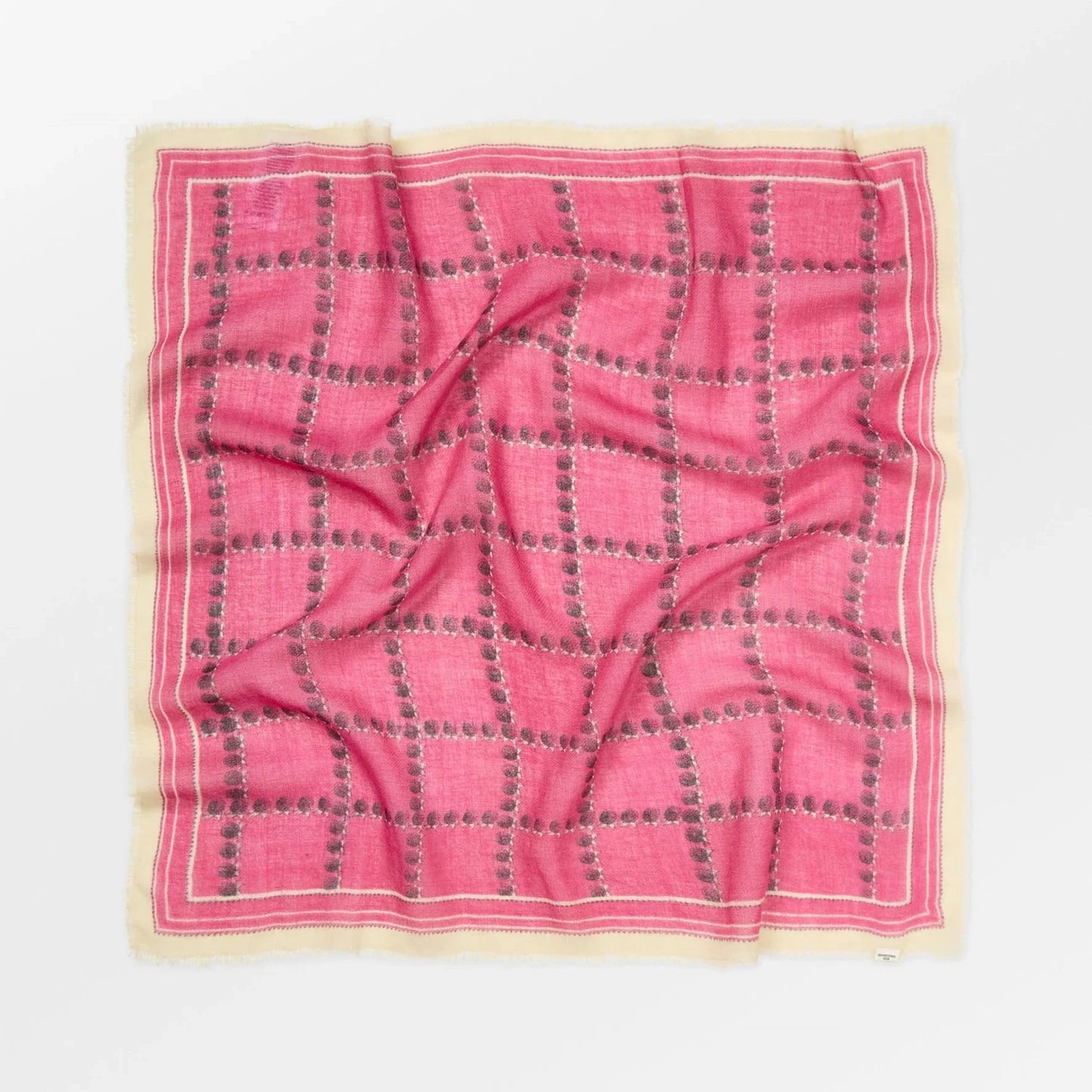 Pink checkered fabric on a white background