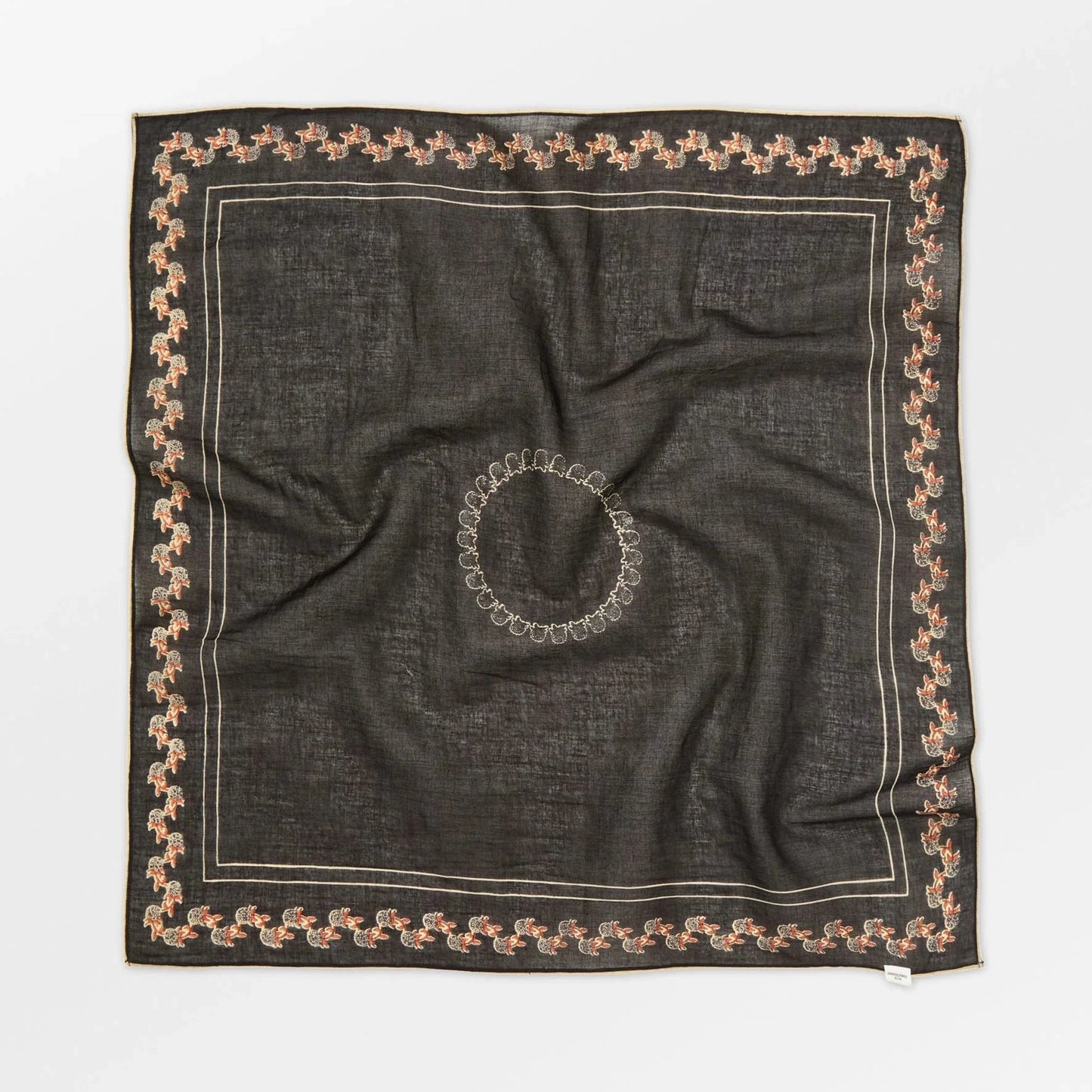 Black square scarf with decorative border on a white background