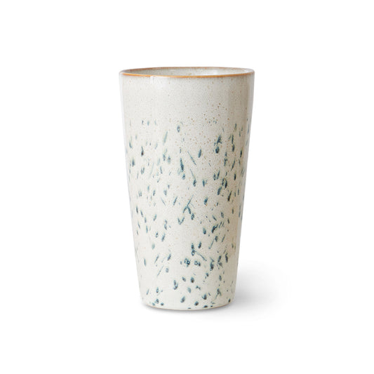 Speckled ceramic tumbler on a white background