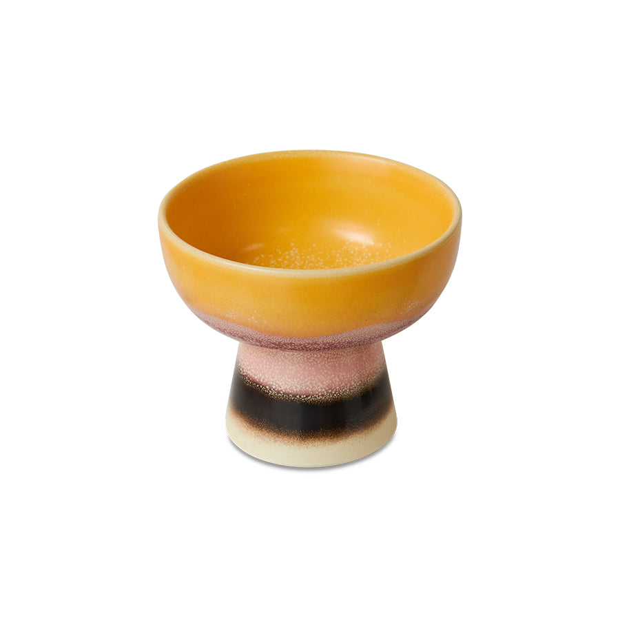 Yellow ceramic bowl with a textured design on a white background