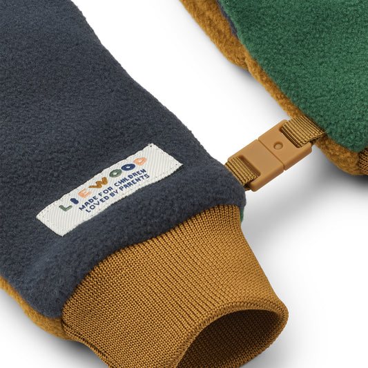 Pair of children's mittens with a visible Liewood brand label on a white background