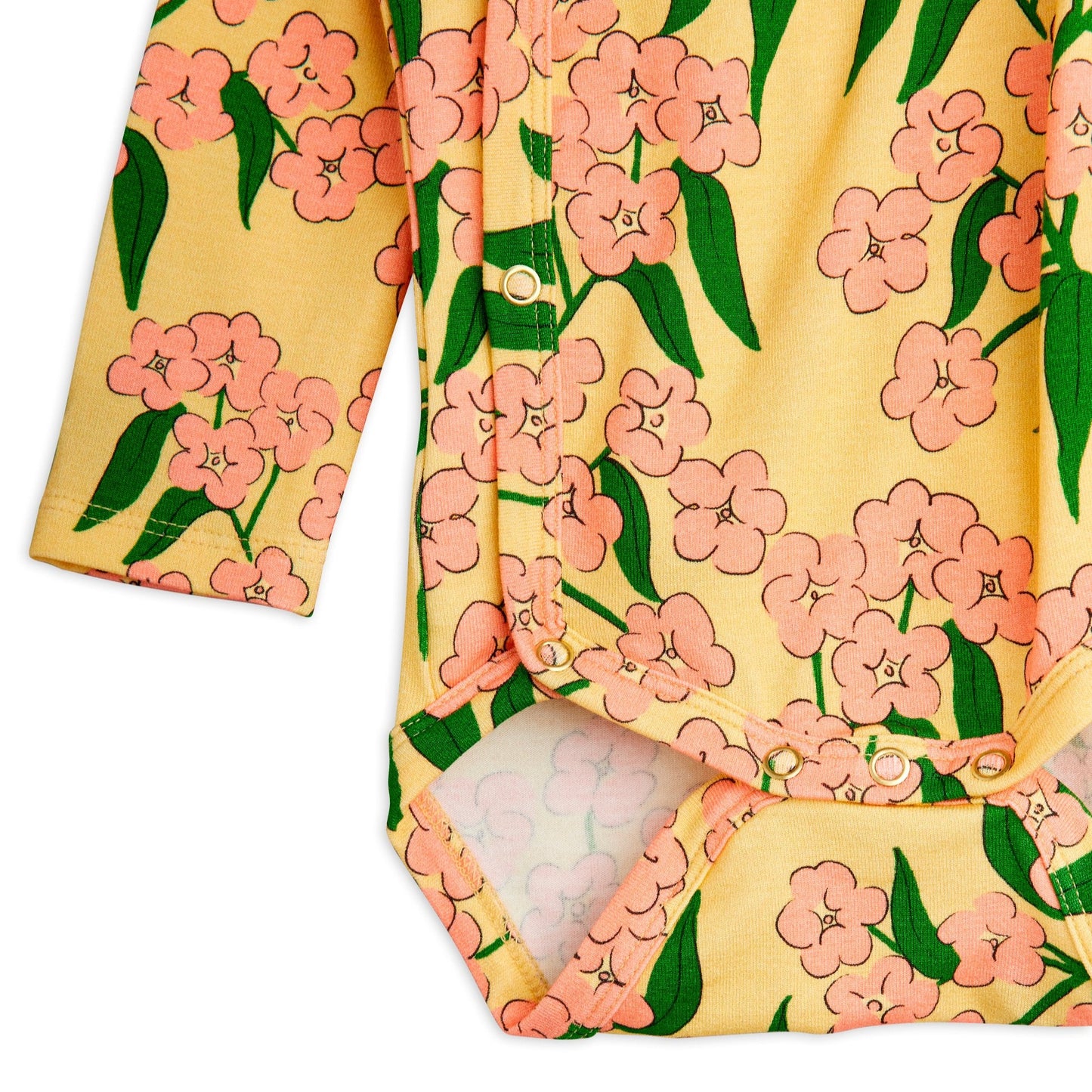 Floral patterned baby outfit on a white background