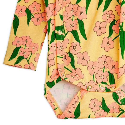 Floral patterned baby outfit on a white background