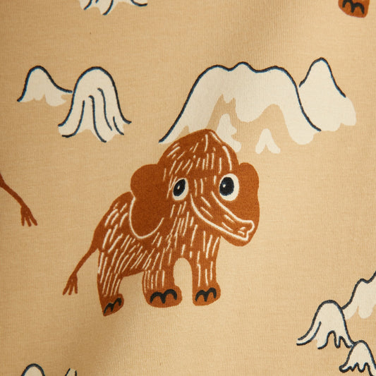 Image of a brown mammoth with mountains on beige leggings