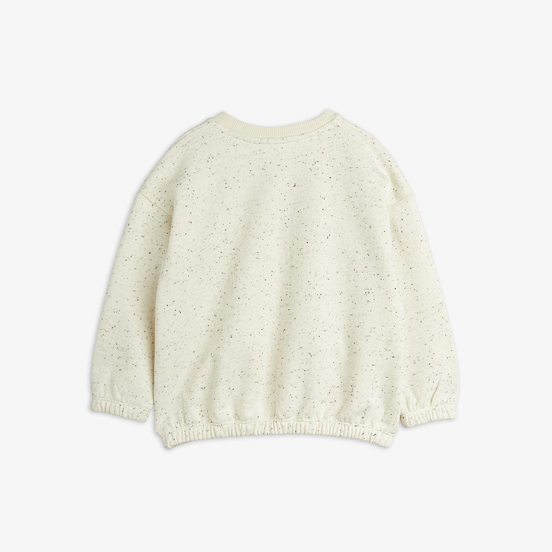 White knitted sweater on a light beige background