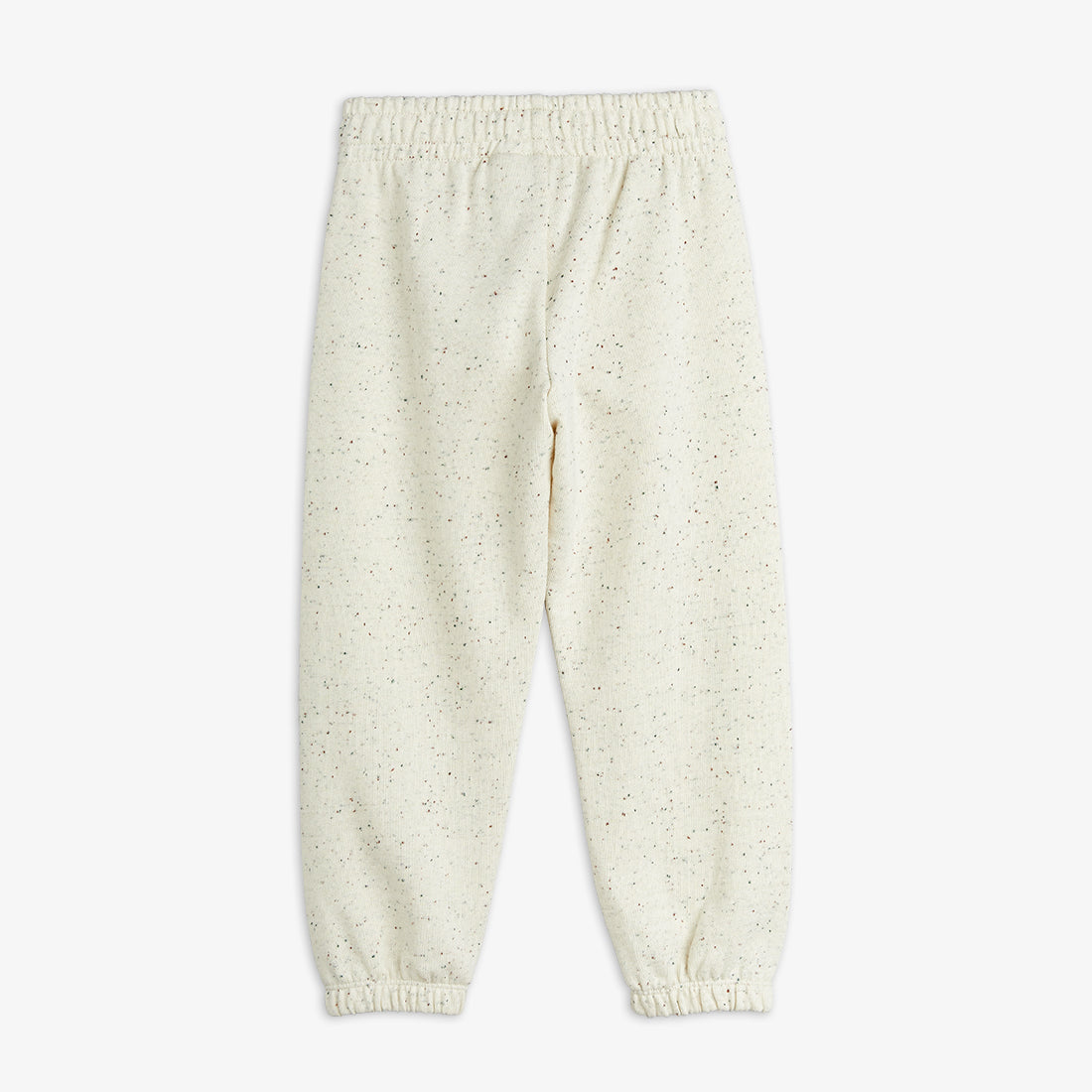 Cream-colored baby pants on a white background