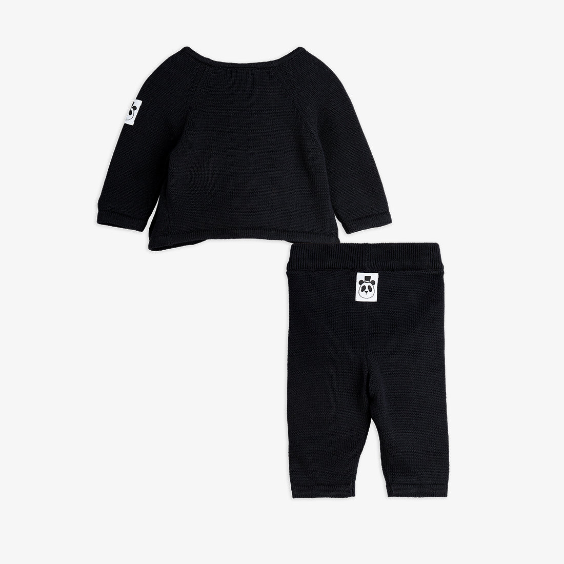 Black baby sweater and pants set on a white background