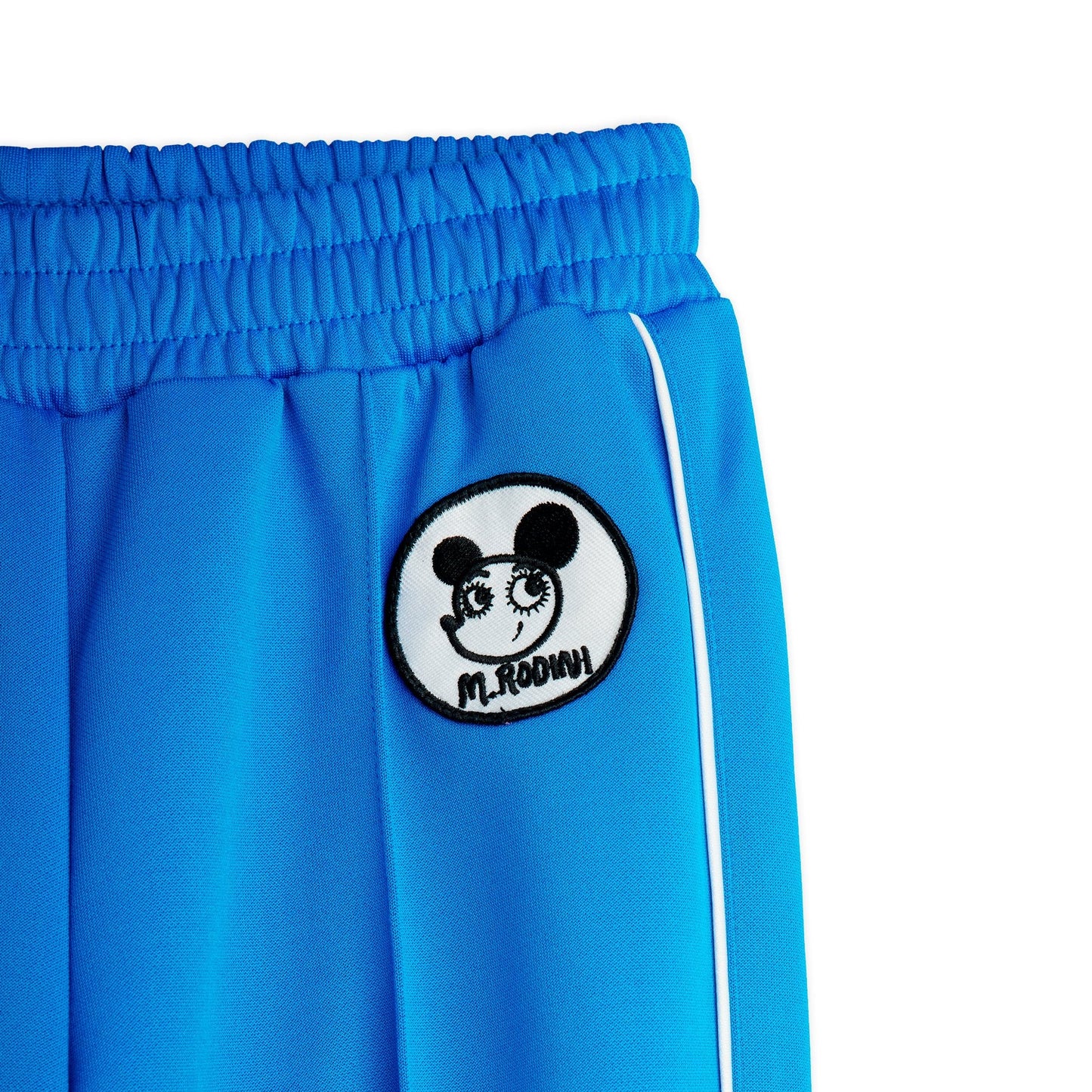 Blue pants with a black and white logo on a white background
