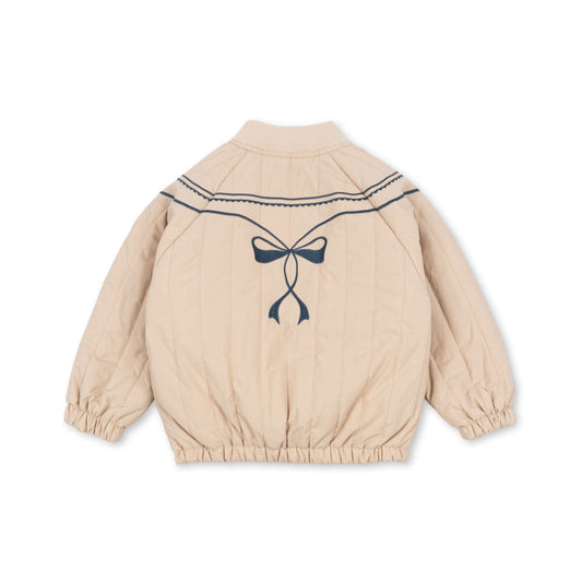 Beige children's jacket with a bow design on a white background