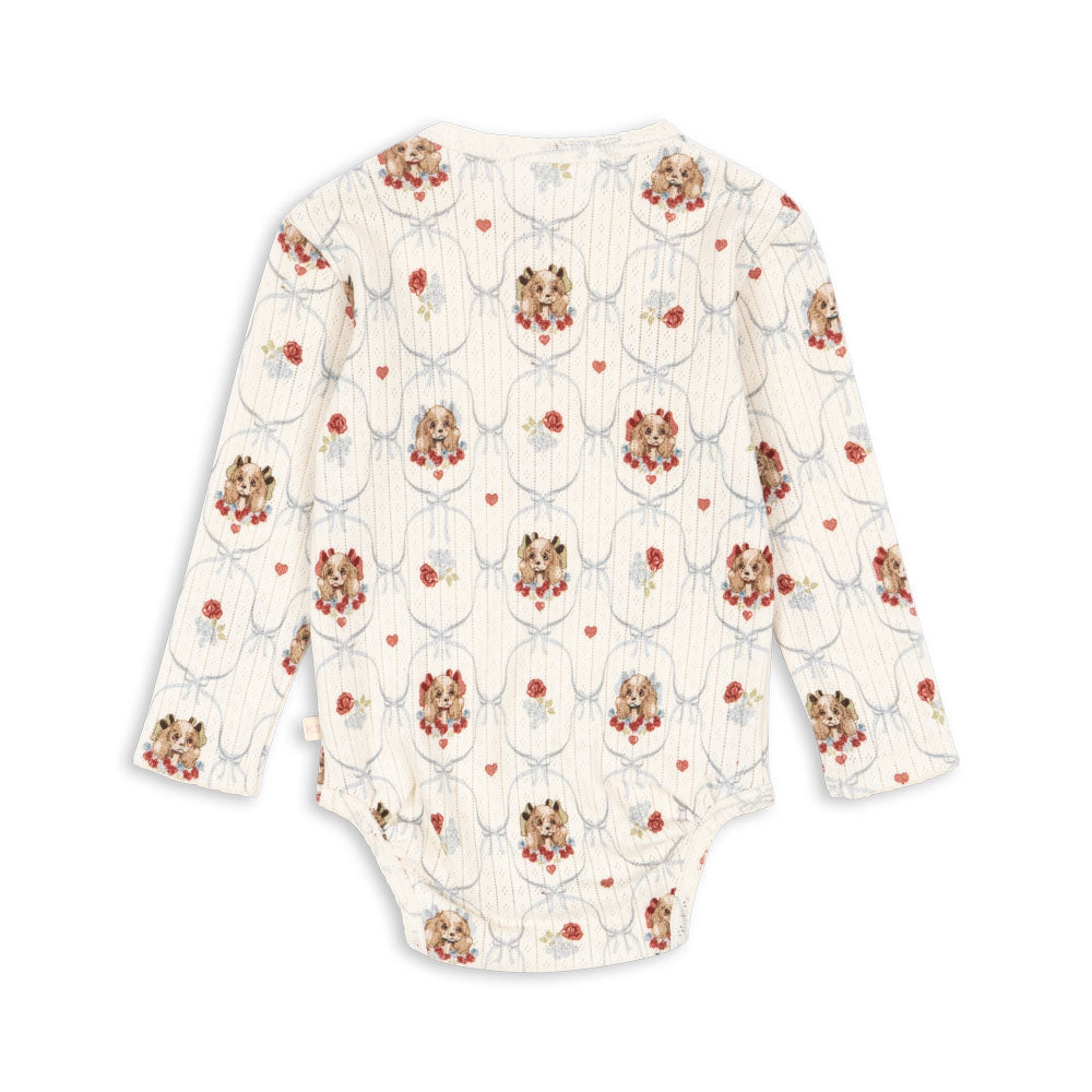 Floral-patterned baby onesie on a white background