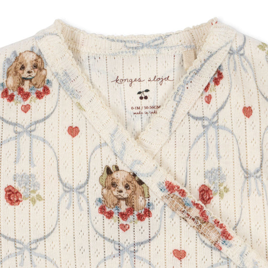 Baby romper with dog pattern and Konges Slojd label
