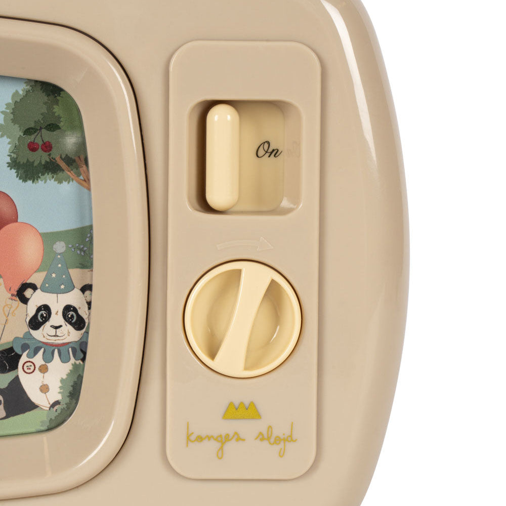Beige children's toy with panda illustration and control knobs on a white background
