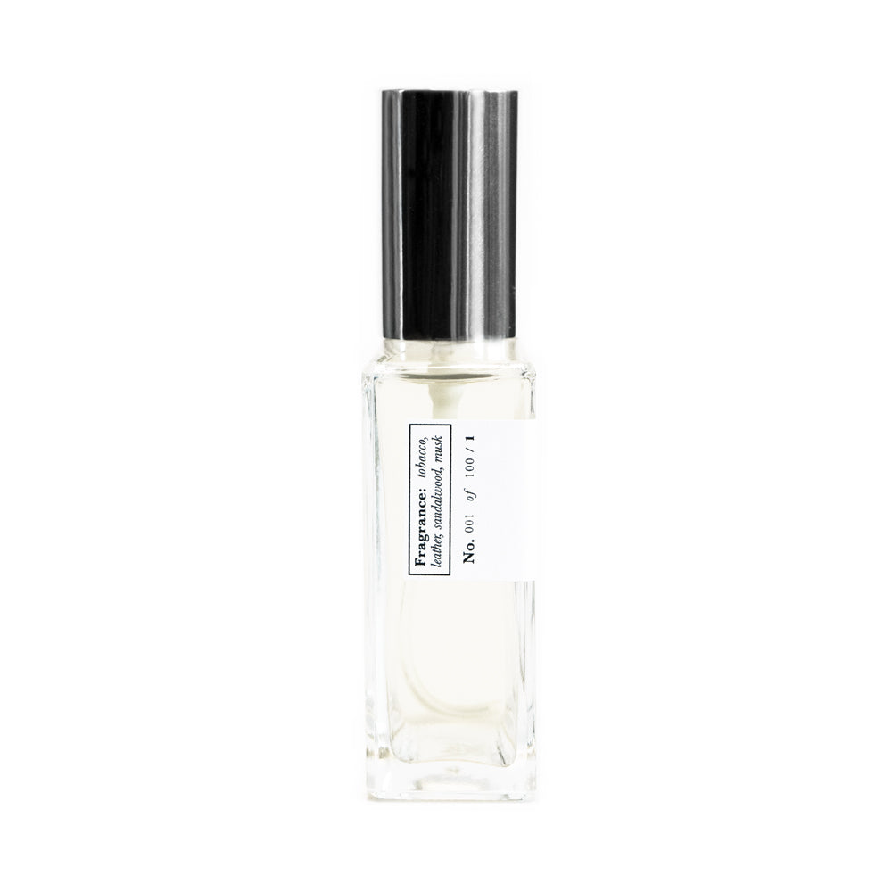 A side view of a clear glass bottle of Saint Rita Parlor perfume with a silver cap, labeled 'Rita's Car' with a volume of 60ml.