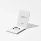 Cosmetic product with a white card on a light gray background