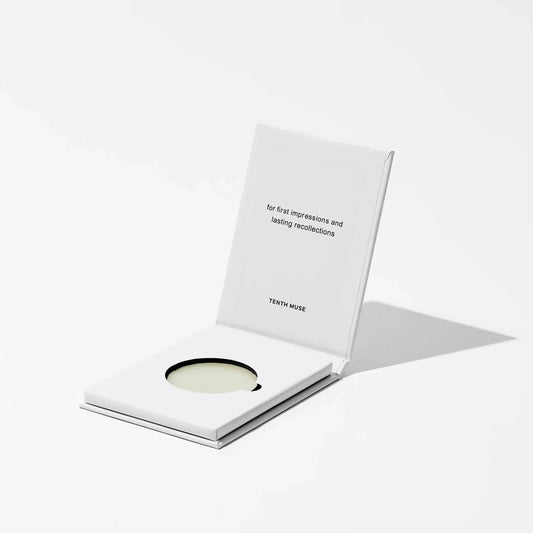 Cosmetic product with a white card on a light gray background