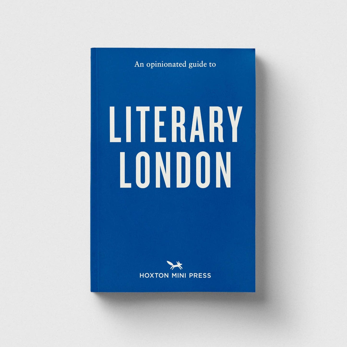 Blue book titled 'An Opinionated Guide to Literary London' by Hoxton Mini Press on a white background