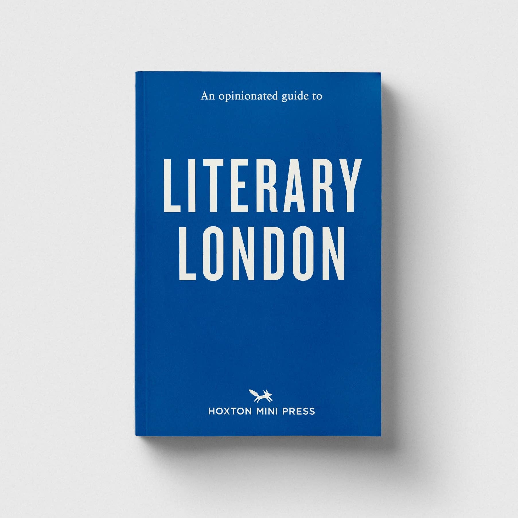 Blue book titled 'An Opinionated Guide to Literary London' by Hoxton Mini Press on a white background