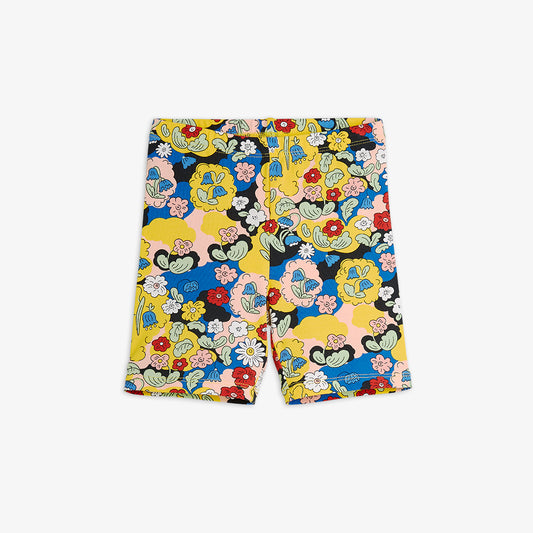 Colorful shorts with floral and character design on a white background