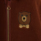 Brown fleece jacket with a teddy bear emblem and zipper