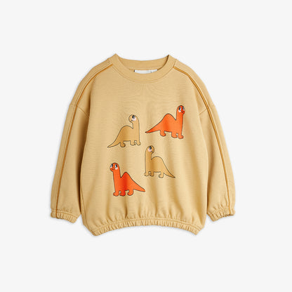 Beige sweatshirt with dinosaur illustrations on a white background