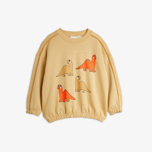 Beige sweatshirt with dinosaur illustrations on a white background