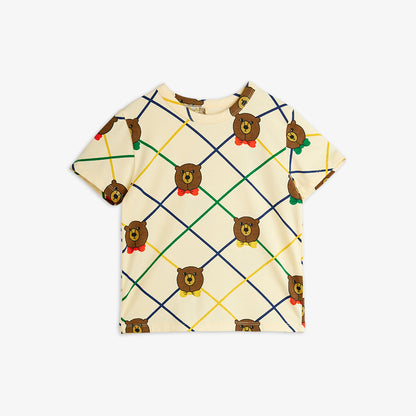 T-shirt with teddy bear pattern on a beige background