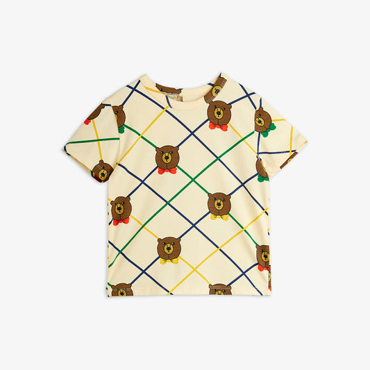 T-shirt with teddy bear pattern on a beige background